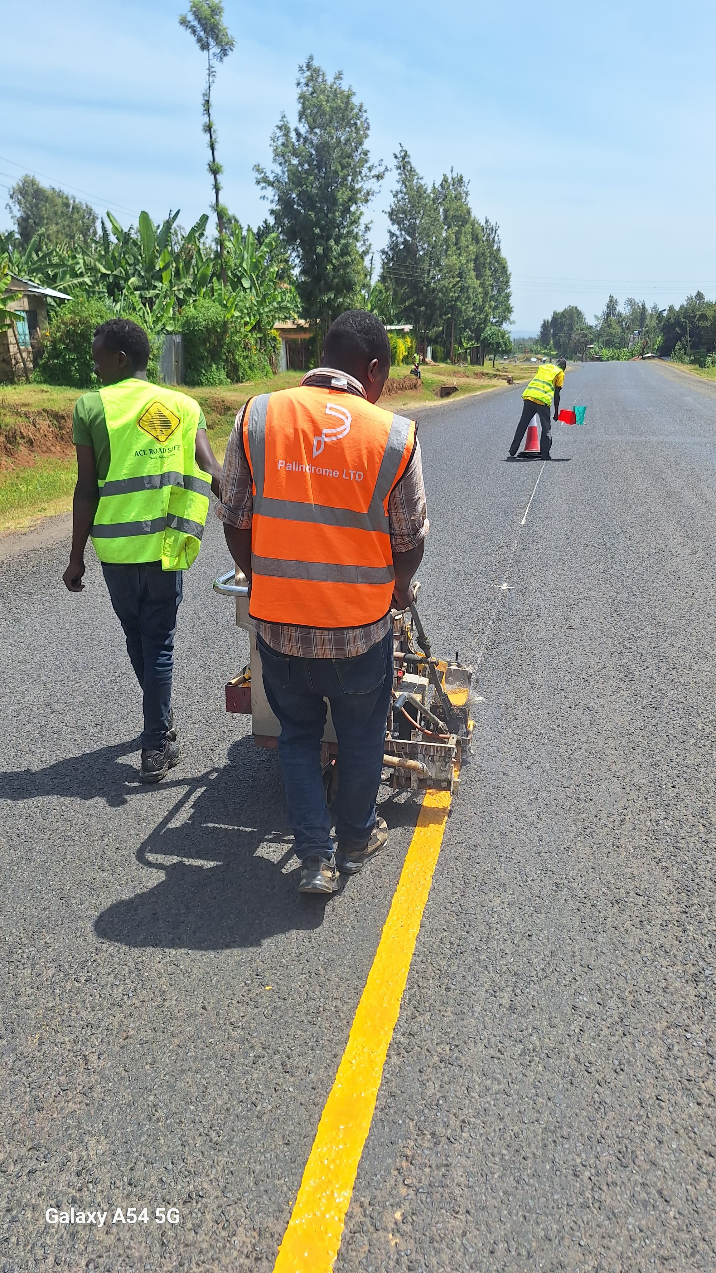 Precision yellow continuous centerline road marking on highway